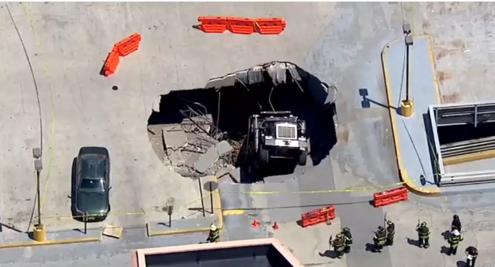 Dump Truck Falls Through Upper Deck of New Jersey Parking Garage [VIDEO]