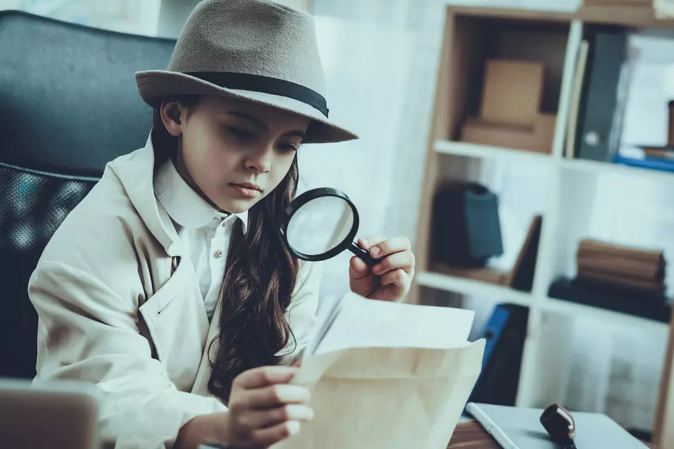 Little Girl Detective with Magnifying Glass