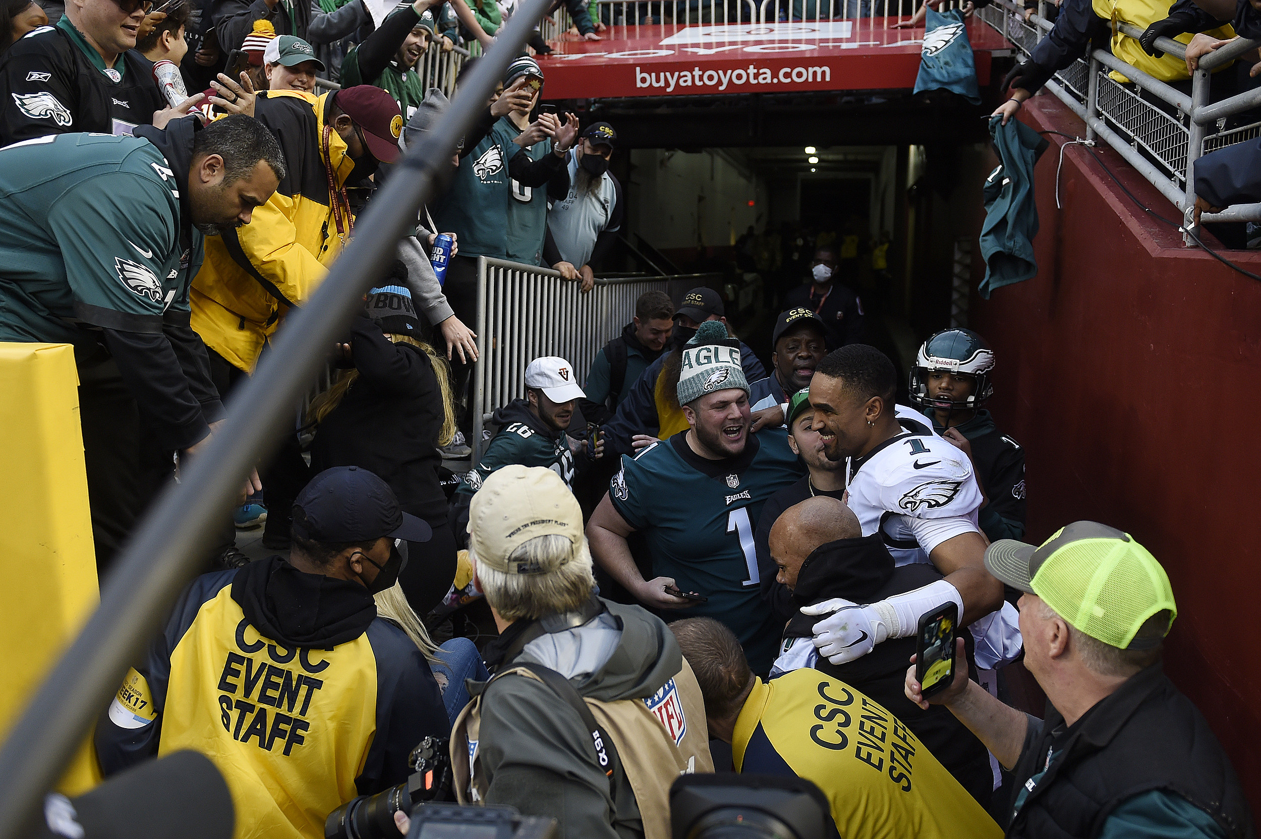 Eagles QB Jalen Hurts nearly sacked after railing collapses, fans fall at  FedEx Field