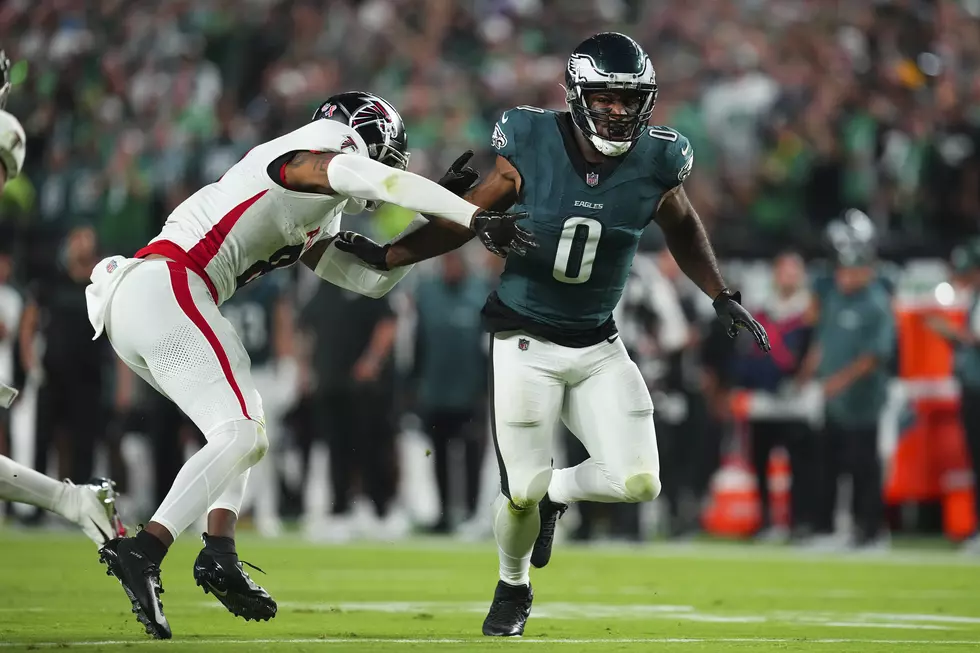 Bryce Huff #0 of the Philadelphia Eagles rushes the passer against Kyle Pitts #8 of the Atlanta Falcons