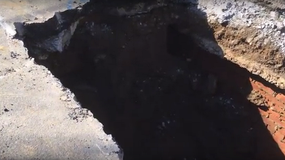 Watch as a Giant Sinkhole Swallows a Vehicle in Albany