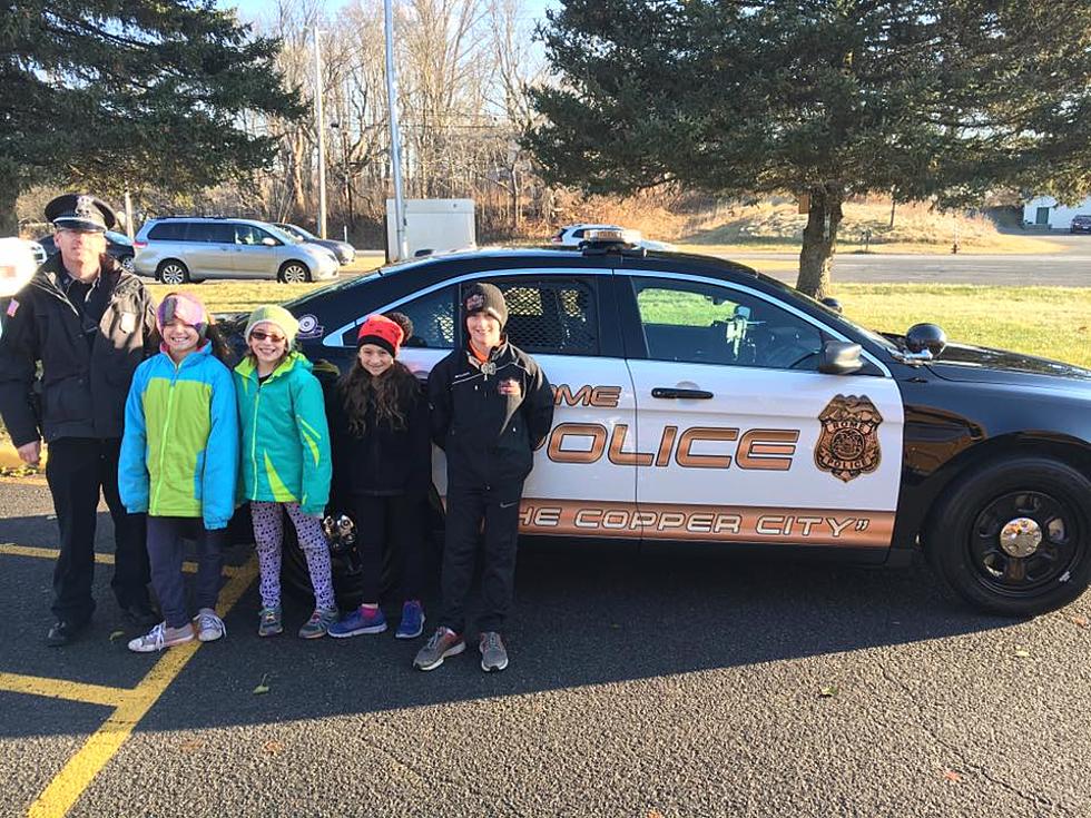 CNY Kids Get a Ride in a Police Cruiser for a Good Cause