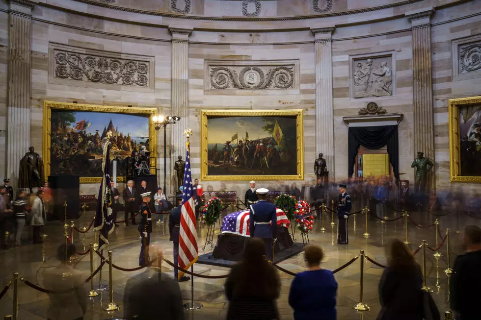Solemn Public Pays Tribute As Bush Lies In State In Rotunda