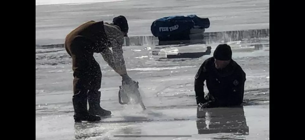 Snowmobile Passengers Self Rescue After Sled Falls Through Ice