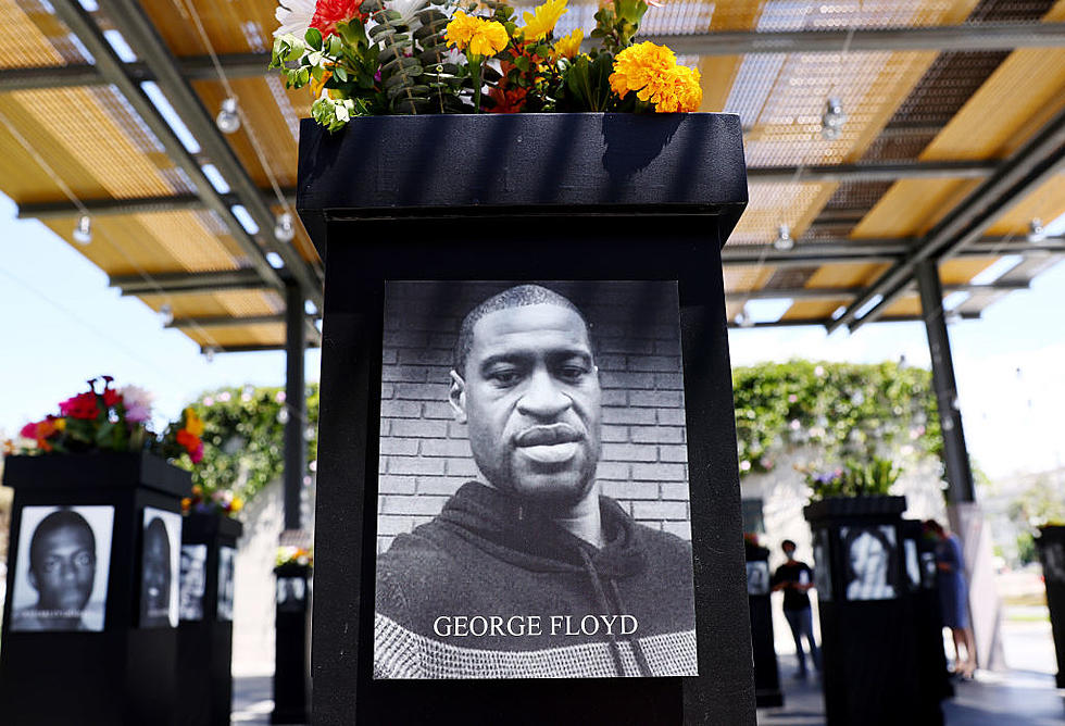 The sisters of Car accident victim Michael Evans leave flowers at the  News Photo - Getty Images