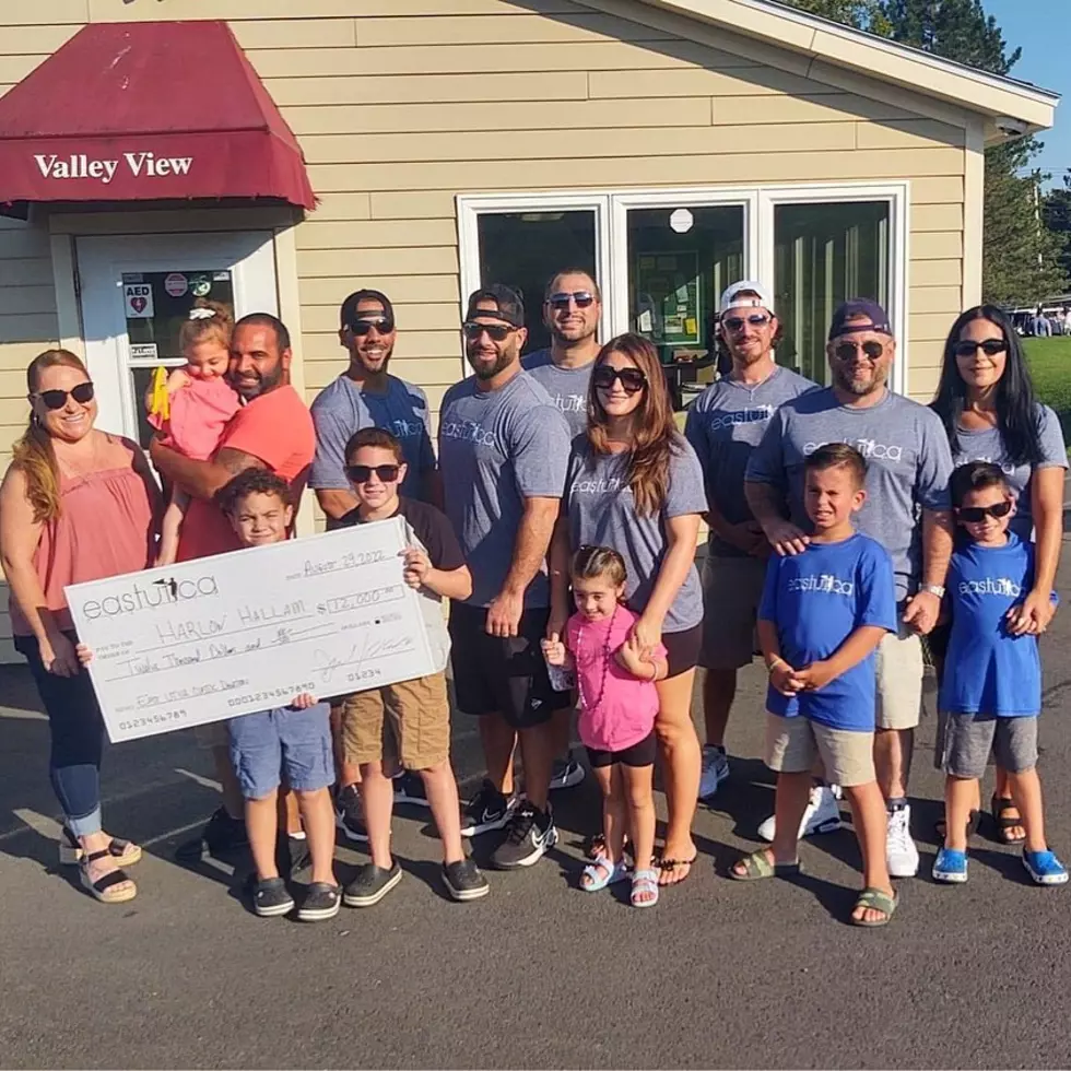 East Utica Golf Tournament Presents Check to Local Family