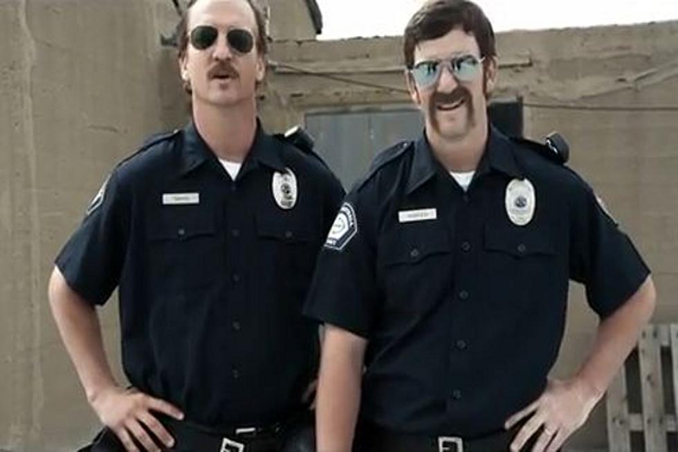 The Manning Brothers Ham It Up As ‘Football Cops’ in Hilarious New Video [VIDEO]