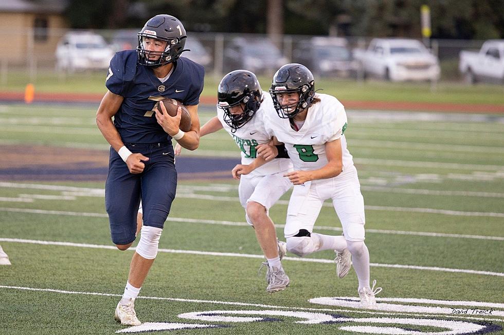 PhotoFest: Cody Runs By Lander in Week Zero Football