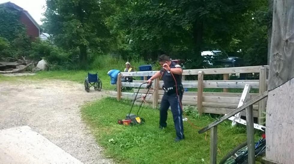 Kalamazoo Officers Mow Lawn for Man in Wheelchair