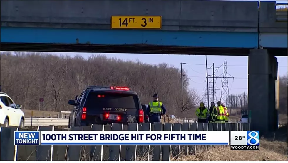 Watch This Truck Try To Make The Tight Squeeze To Drive A House Under A Bridge