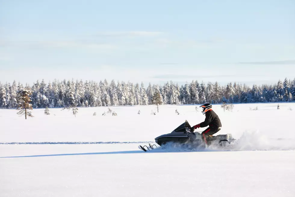 Classic Snowmobiles to Cross Mackinac Bridge