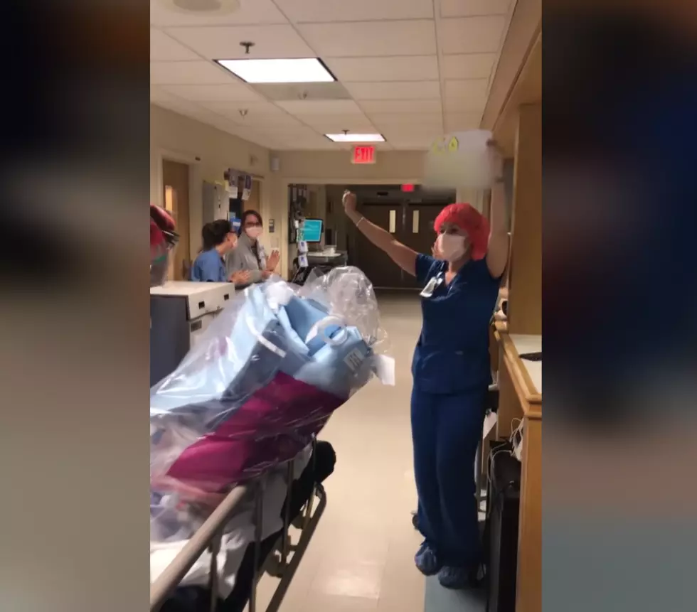 Hospital Employees Applaud Recovering COVID-19 Patient