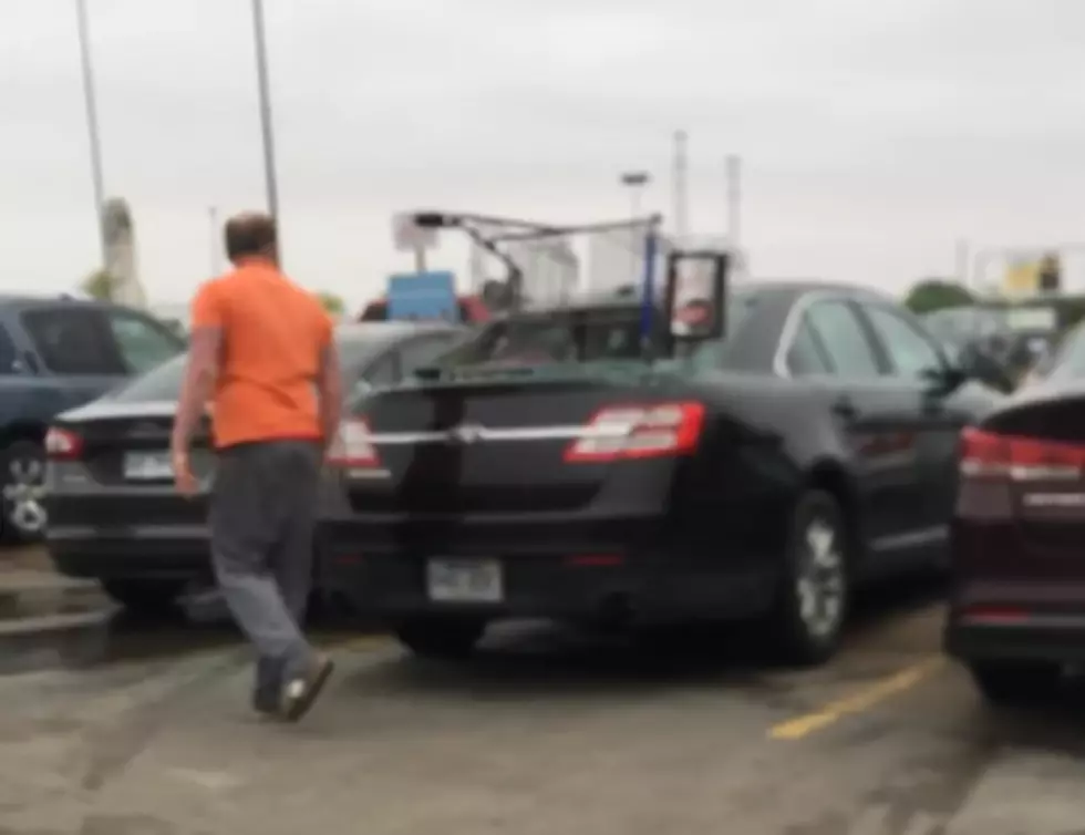 Watch This Idiot Smash Someone’s Car Window With Something Unusual
