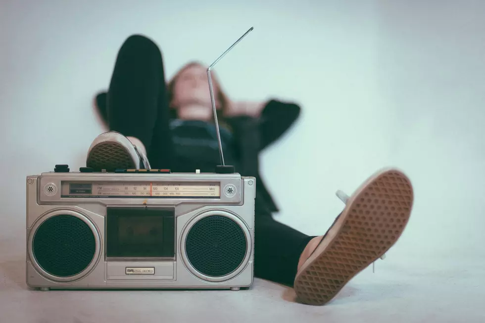 Boy sitting listening to the radio
