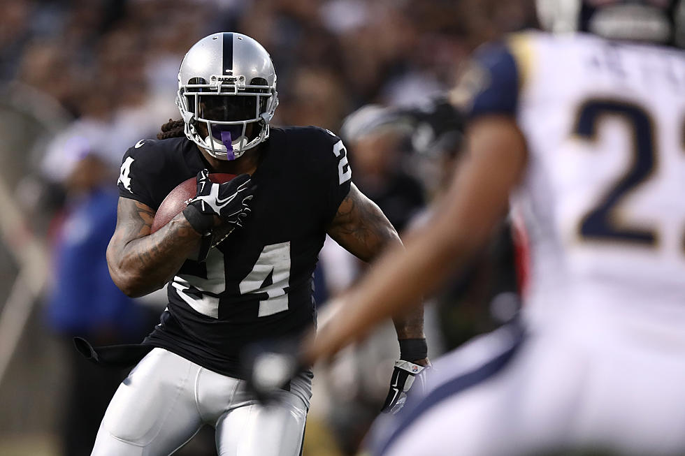 Raiders RB Marshawn Lynch Sits During National Anthem