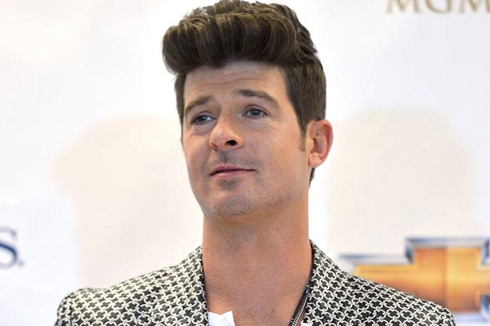 Robin Thicke Crashes Porsche