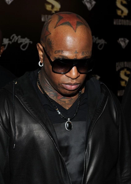 Birdman take grills out of his mouth Now Removing Tattoos from his face   mymusicmylifecom