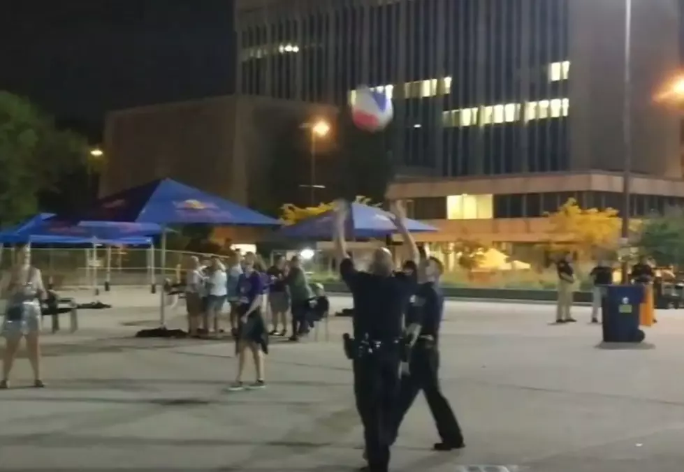 Watch the GRPD Take Time Out to Play Beach Ball Volleyball With Teens After Grand Rapids Pride