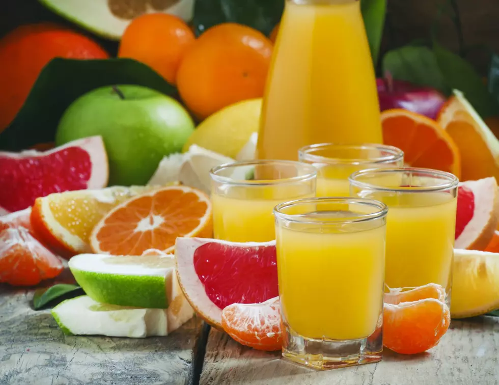 Citrus cocktail, jug, pieces of fruit on a dark background, selective focus