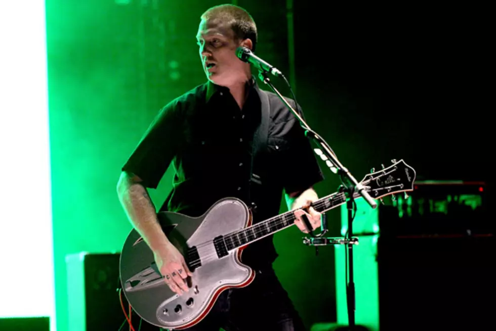 Queens of the Stone Age Fan Jumps Onstage, Promptly Gets Booted Off by Josh Homme