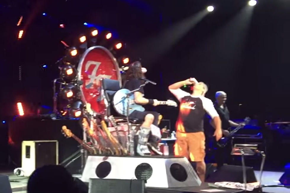 Watch Dave Grohl Chug a Beer With a Fan Onstage