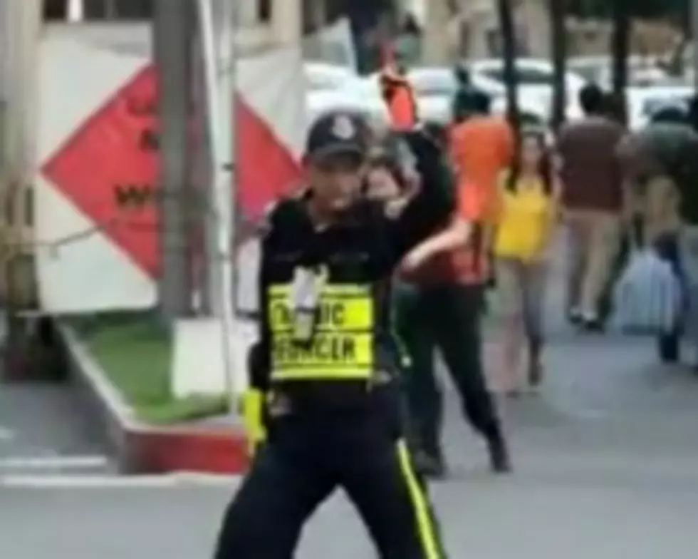 Watch the Dancing Traffic Cop Work it!
