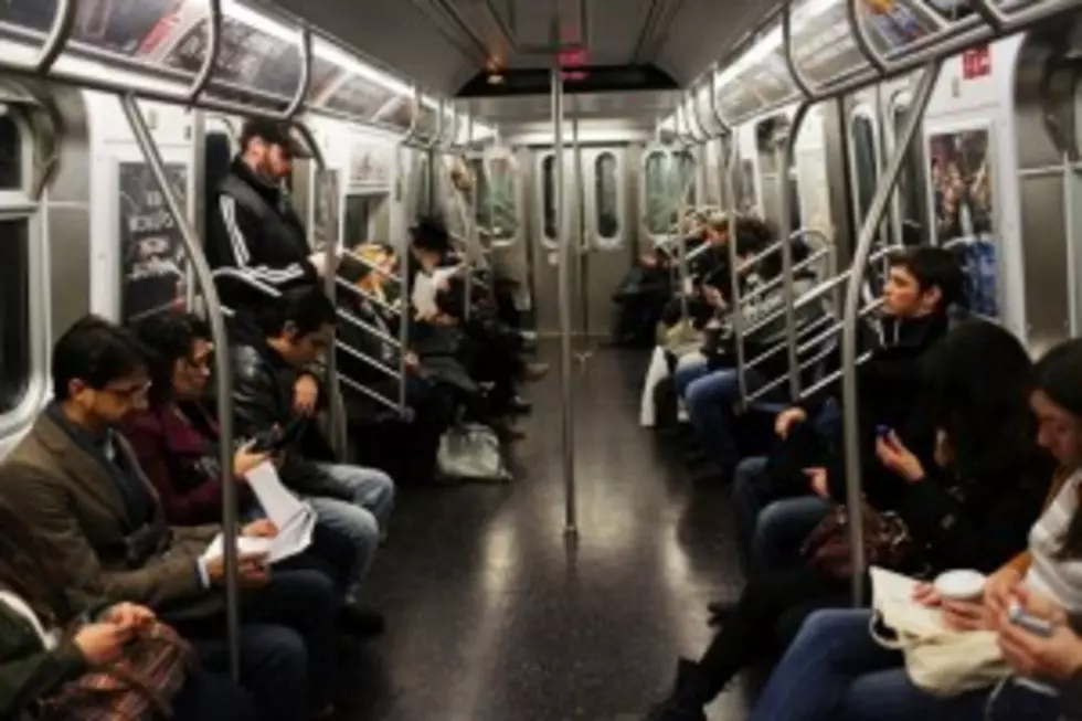 Trapped Man on Subway Train is Freed by Fellow Passengers [Video]