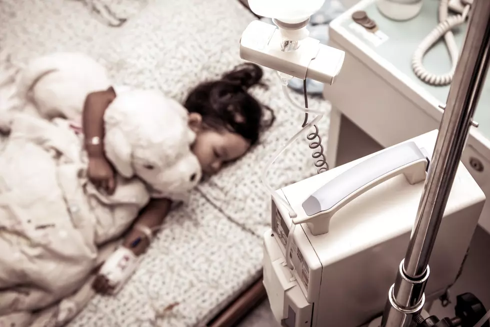 Sick little girl sleeping in the hospital in vintage color filter