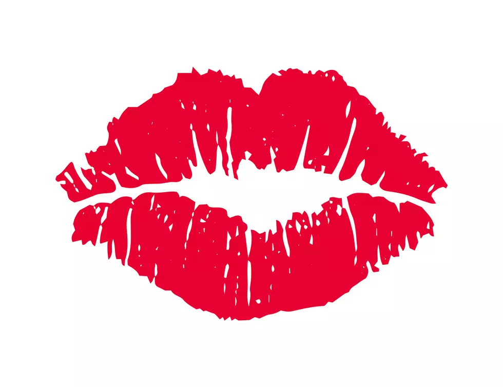 Female red lipstick kiss.