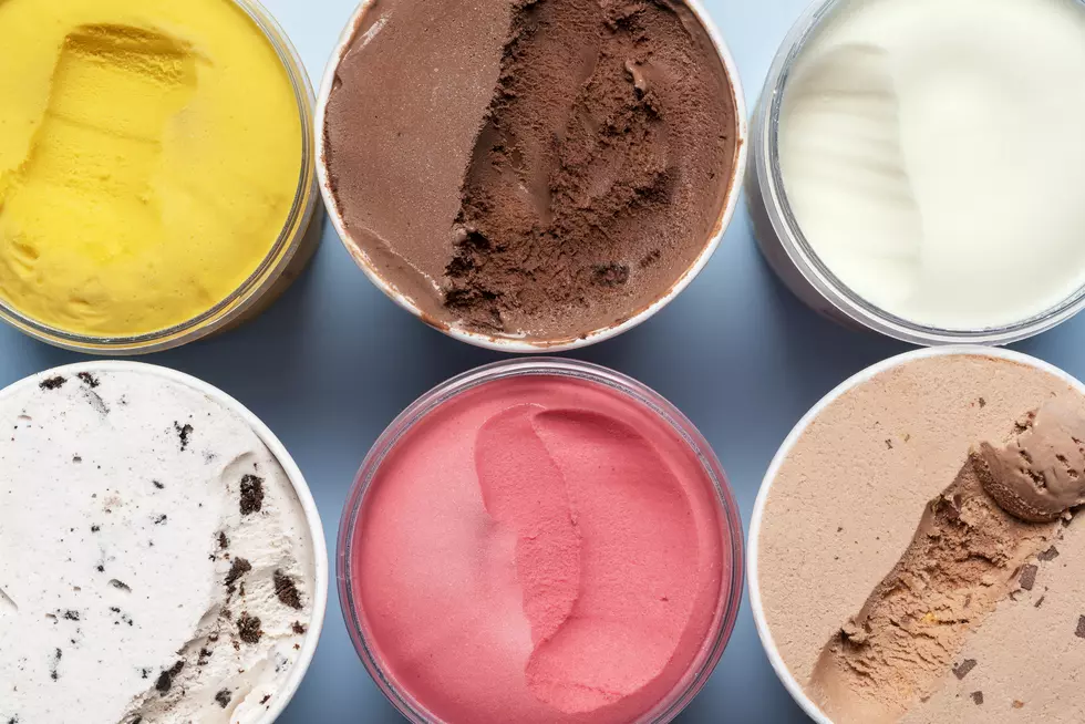 Variety of ice cream and sorbet. Containers with ice cream top view.