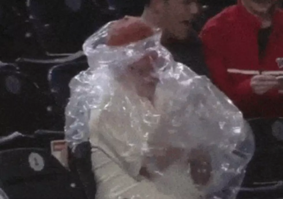 The Struggle Is Real: Man Trying To Get Poncho On Is More Entertaining Than The Game [Video]