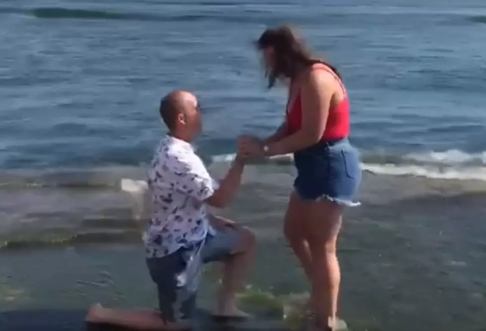 Michigan Man Slips Into Lake Michigan While Proposing [Video]