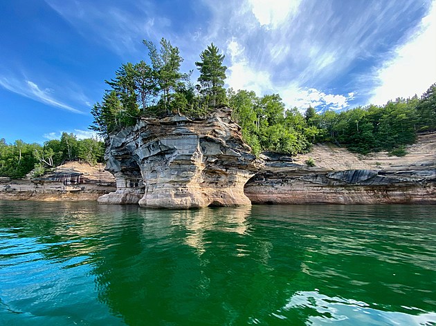 A picturesque blue sky afternoon along Pictured Rocks National Lakeshore on Lake Superior in Pure Michigan’s Upper Peninsula.