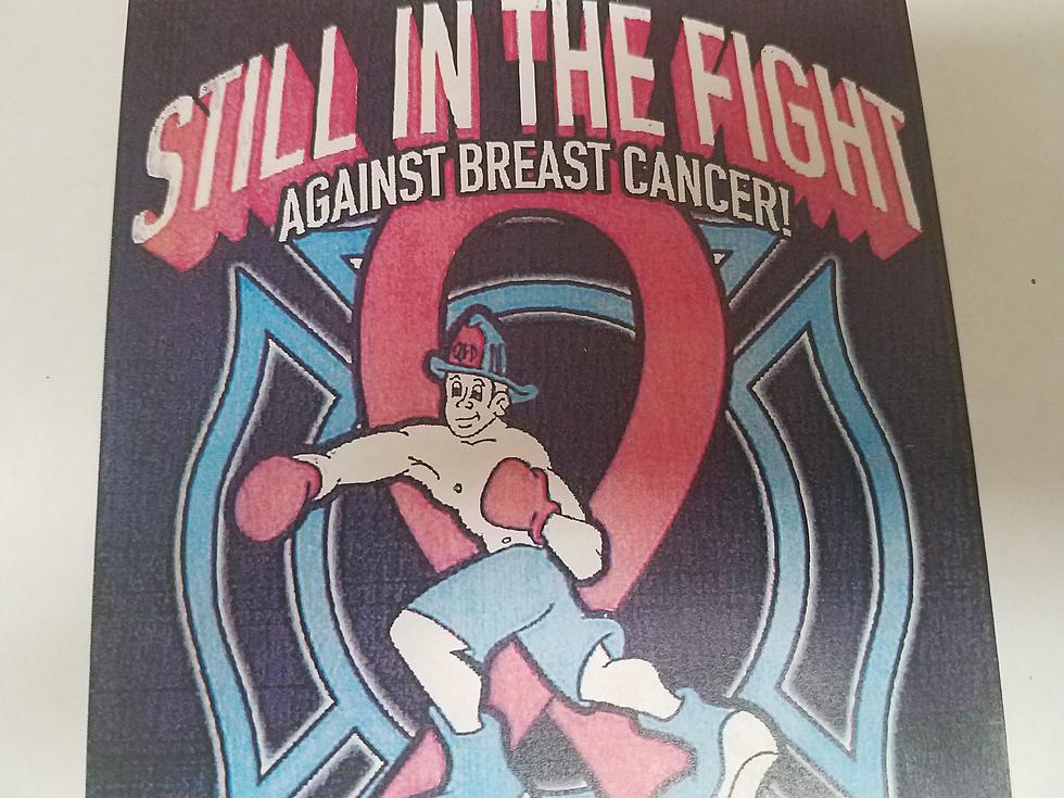 Q.F.D. Selling Breast Cancer Awareness Shirts