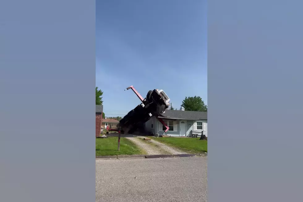 Watch a Crane Trying to Remove a Tree Fall on a Midwestern House