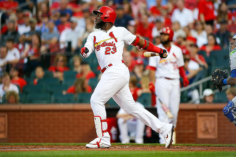 Ozuna, Carpenter homer, Cardinals split DH with Royals 10-3