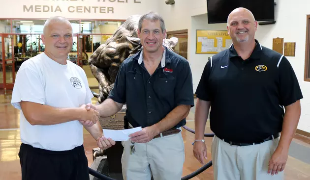 Woods Supermarket Makes Donation to S-C Football Program