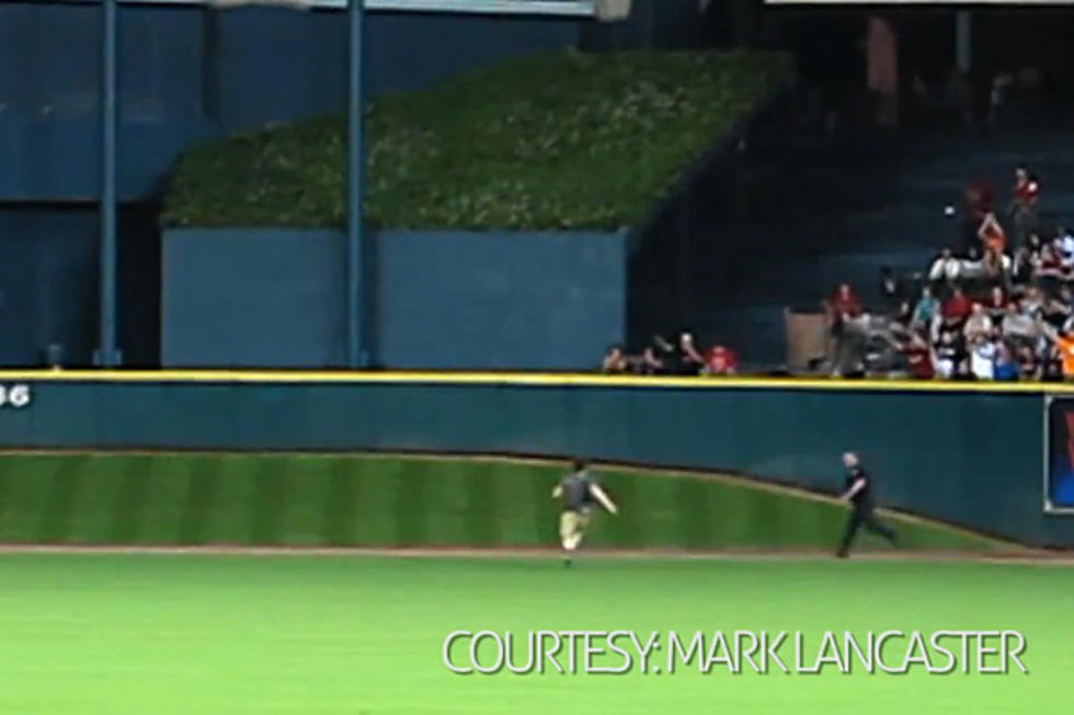 The Great Escape: Baseball Fan Leaps Onto Field, Eludes Police