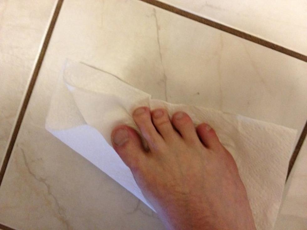 Why Does Todd Harding Cook With A Paper Towel Under His Bare Foot?