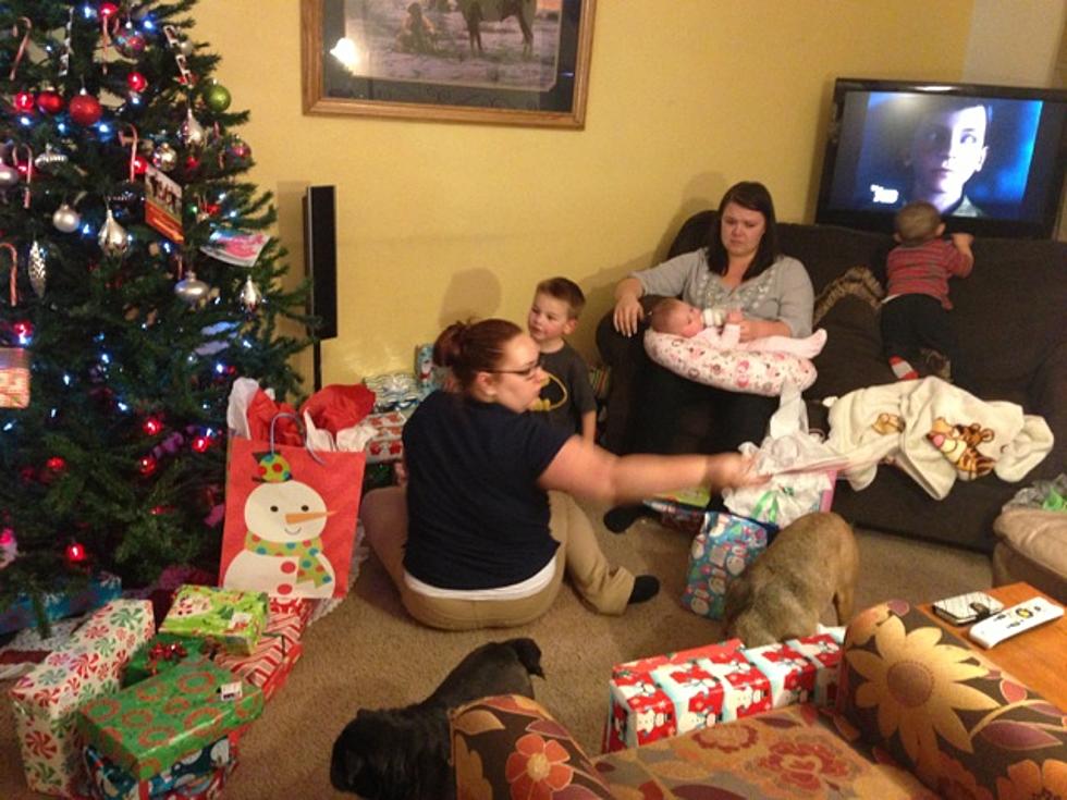 large family opening christmas presents
