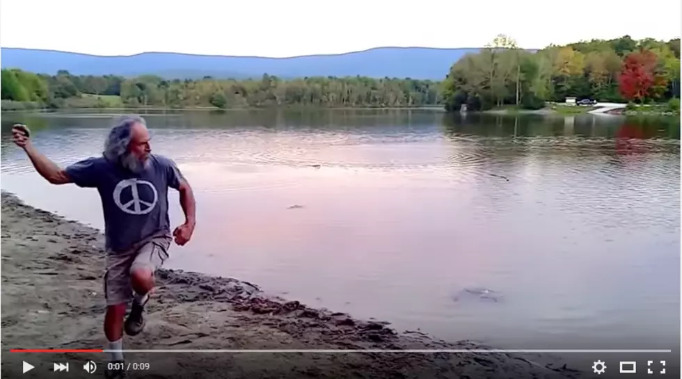 Check Out a Professional Stone Skipper Chuck a Rock Across a Lake