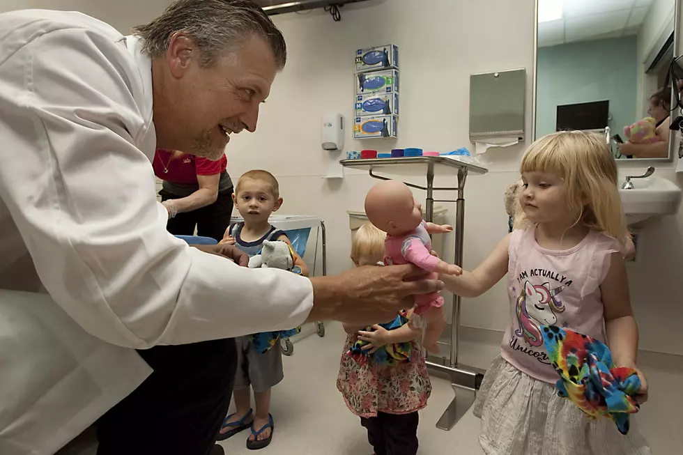 Joel Blocker / For UCHealth UCHealth's Dr. Jamie Teumer, left, reassures Isabel Bashor that her doll is ok during the Teddy Bear Hospital event held at the UCHealth Greeley Hospital on Saturday morning.