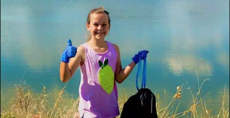 Young Girl Social Distances by Cleaning Windsor Treasure Island Garden