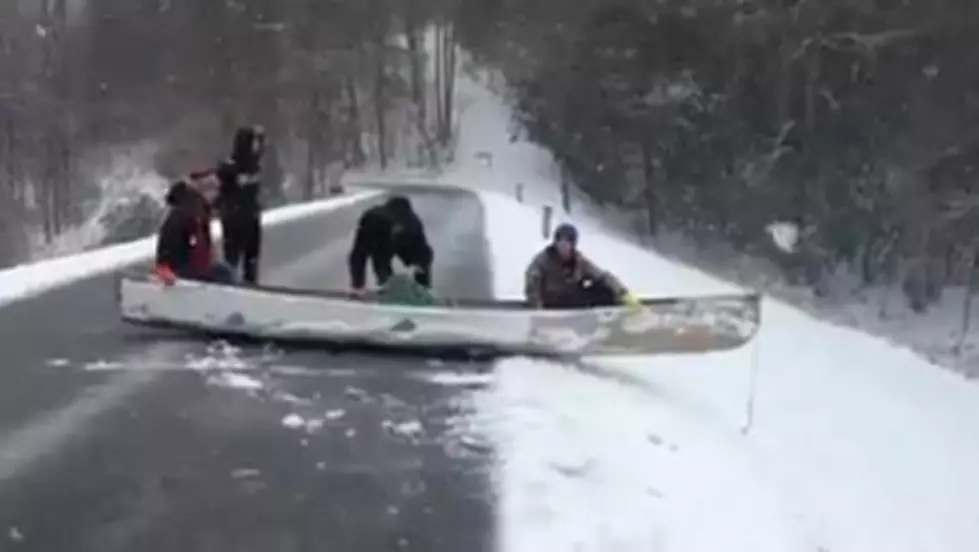 Kids Go Sledding in a Canoe Into a Lake