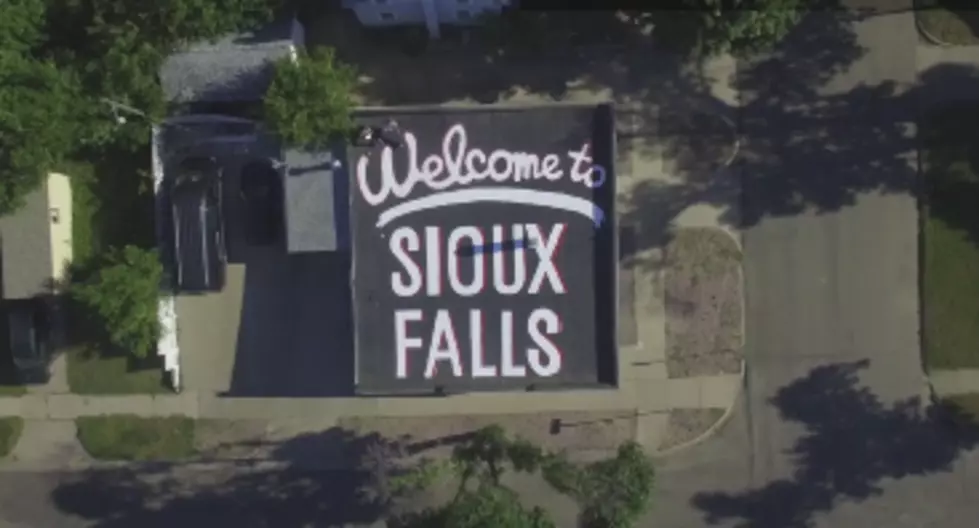 Local Photographer Paints ‘Welcome to Sioux Falls’ on the Rooftop