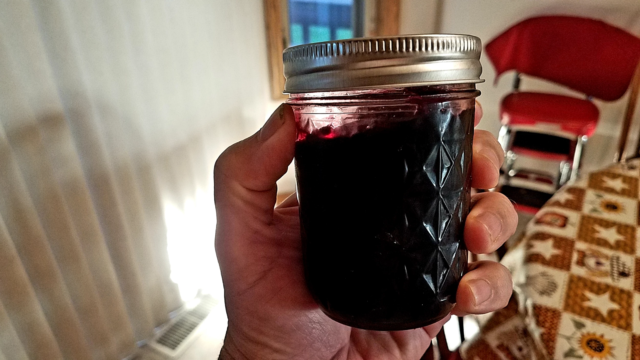 Image of A black chokeberry jelly jar