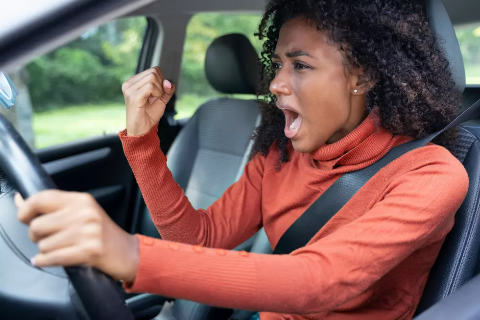 Rude black woman driver arguing and driving car