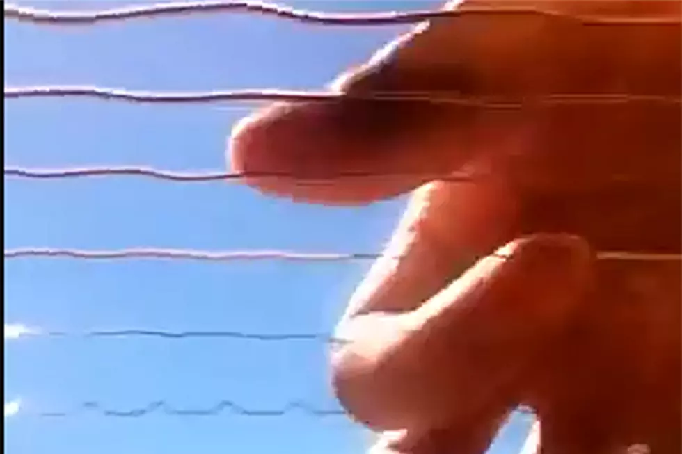 iPhone 4 Video Captures Oscillation of Strings from Inside a Guitar Being Played