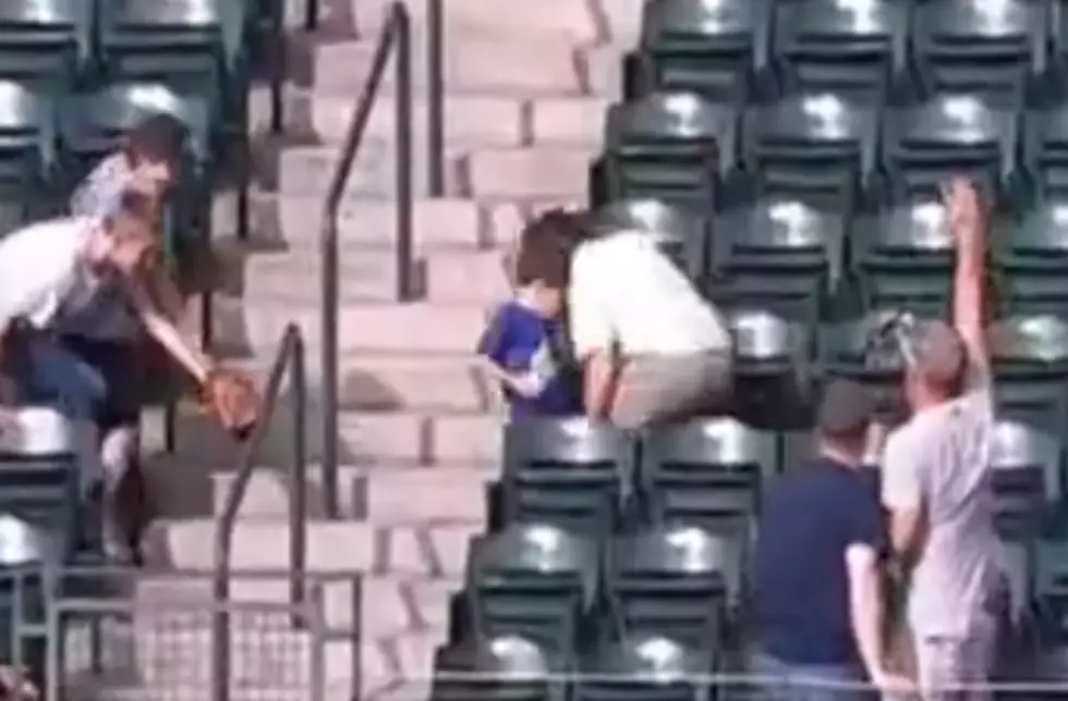 Man Pushes Kid Down To Catch Baseball [VIDEO]