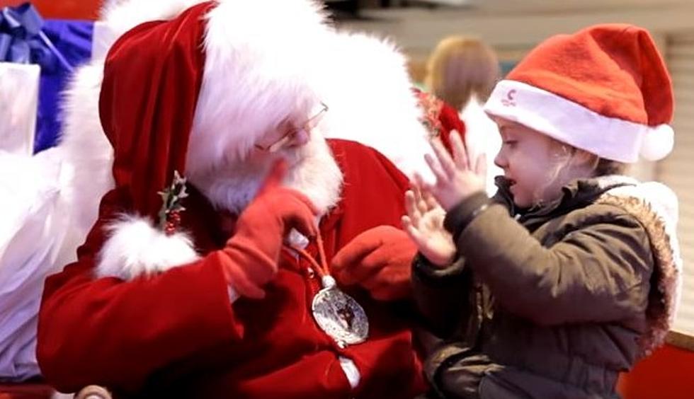 Santa Signing To A Child
